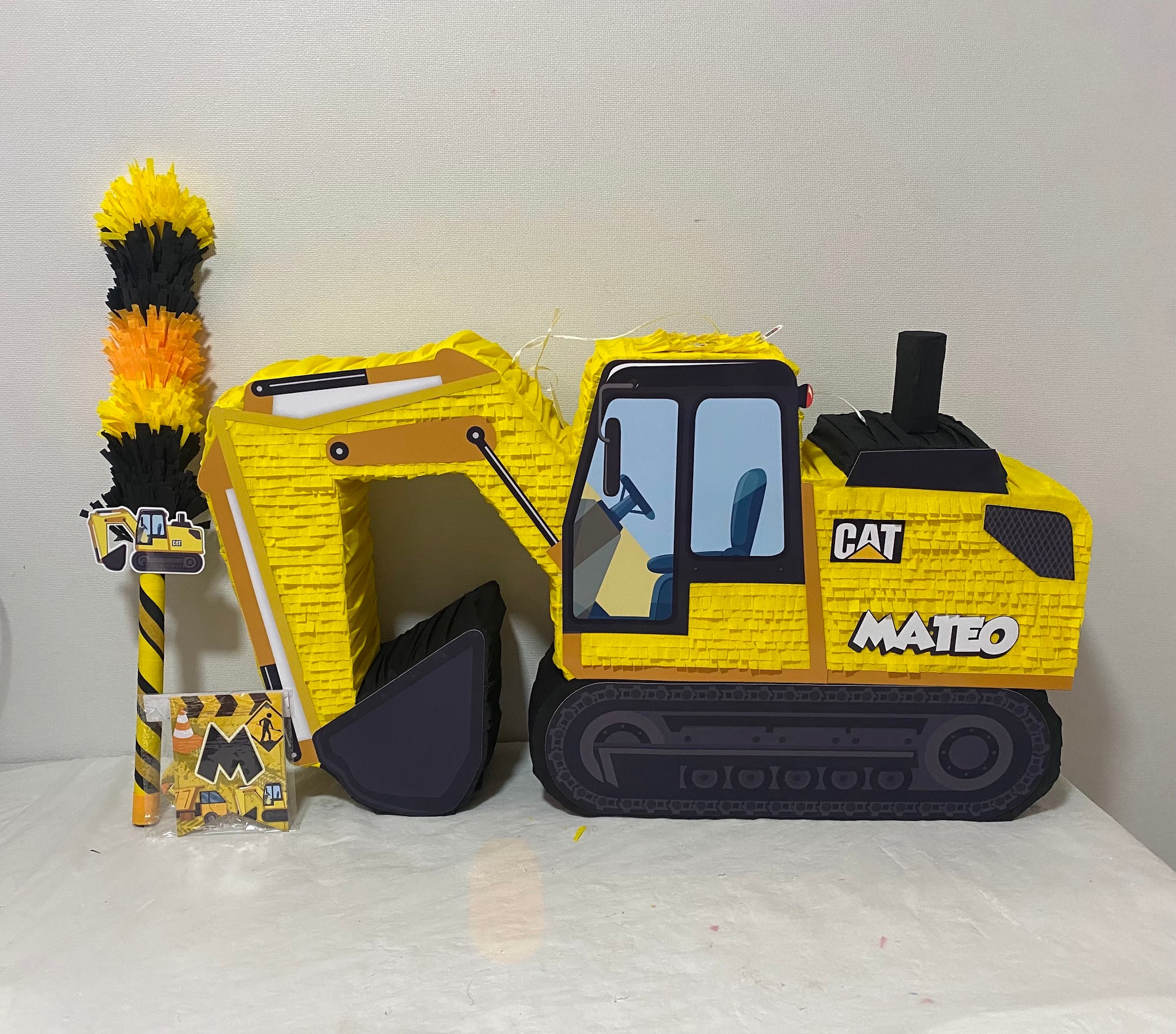 PIÑATA CAMIÓN EXCAVADORA CAT 60CM PREMIUM